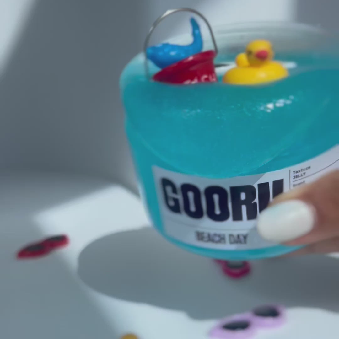 Product video of Beach Day Slime, with duck and bucket charms, designed by Gooru Slime, Dubai, UAE, 